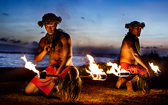two hawaiian males dancing